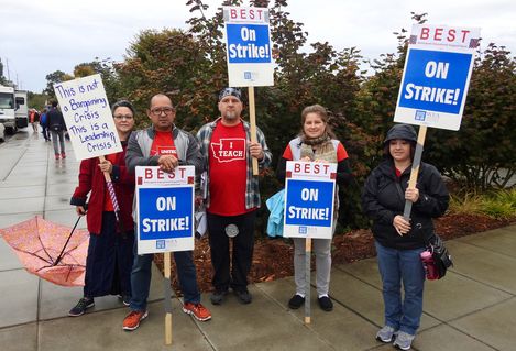 Bellingham Technical College staff members hold strike signs